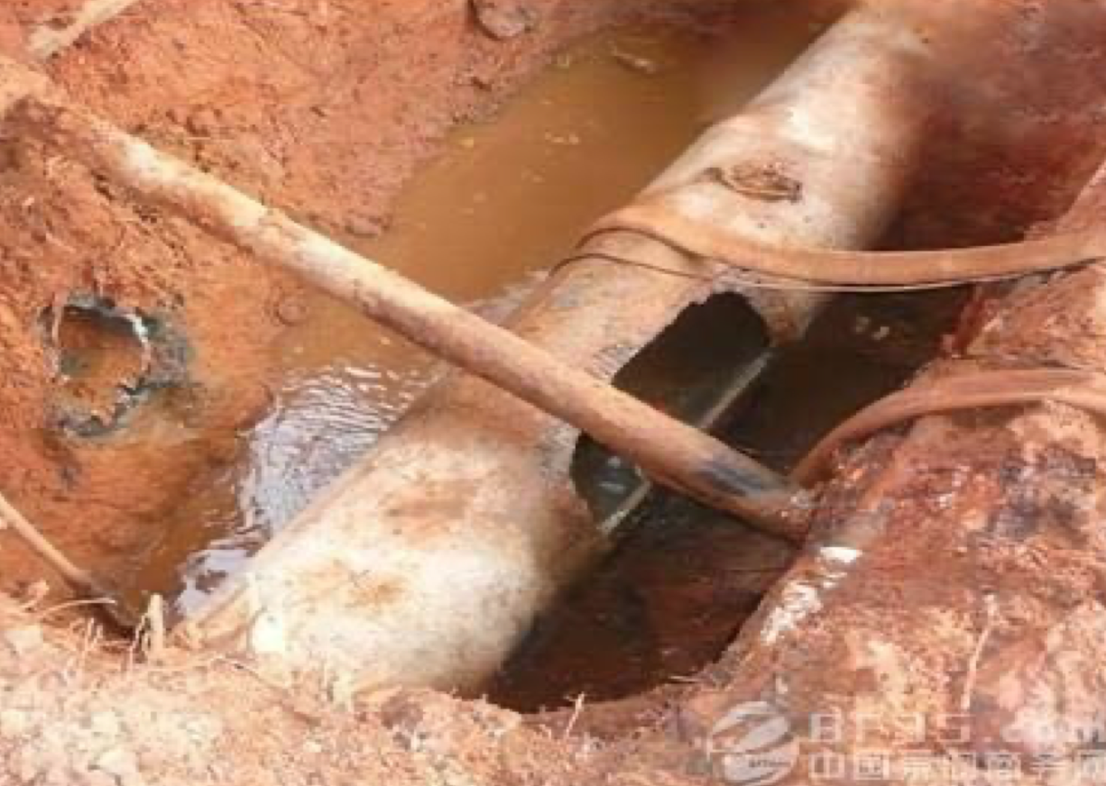 Damaged underground pipeline showing cracking and structural failure